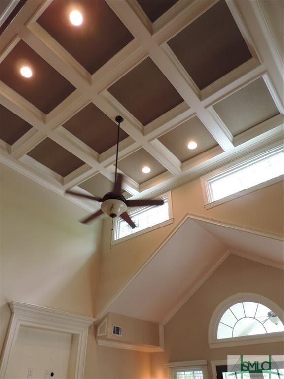 Coffered ceilings, two stories high give spacious,