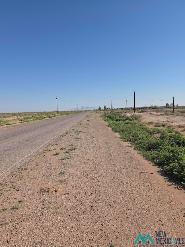 View of asphalt street with a view of rural / pastoral area
