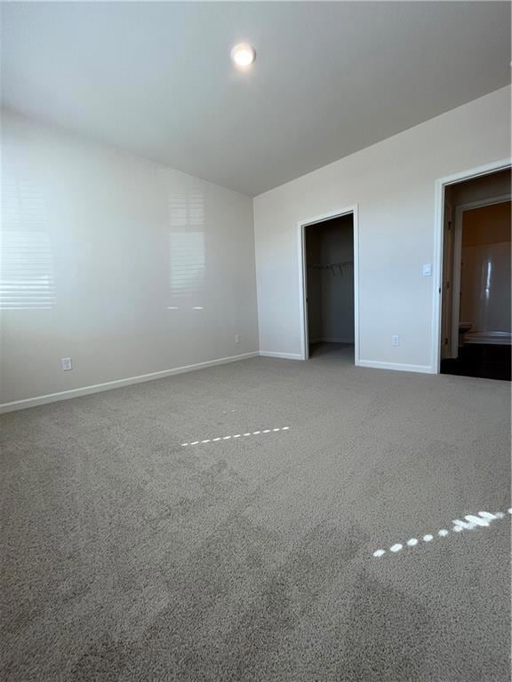 Unfurnished bedroom featuring a closet, carpet, a 