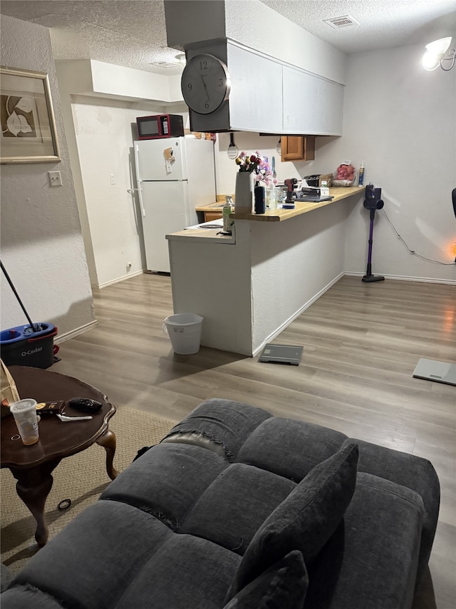 610A - Living, Dinning & Kitchen with Light-wood style luxury plank flooring throughout