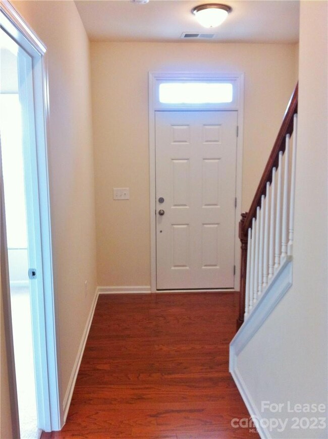 From the front door, enter into the hallway leading to the lower level bedroom & full bath. Climb the stairs to the main level or head straight thru to the garage.