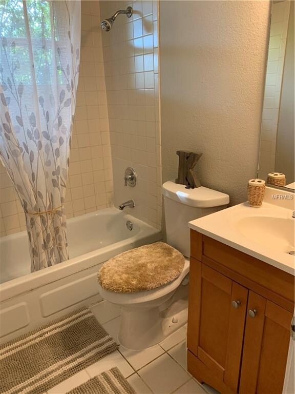 Neutral hall bath is light and bright
