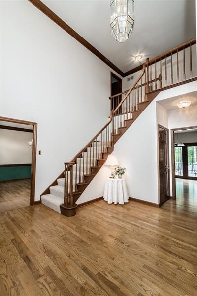 Impressive 2 story entry with hardwood flooring an
