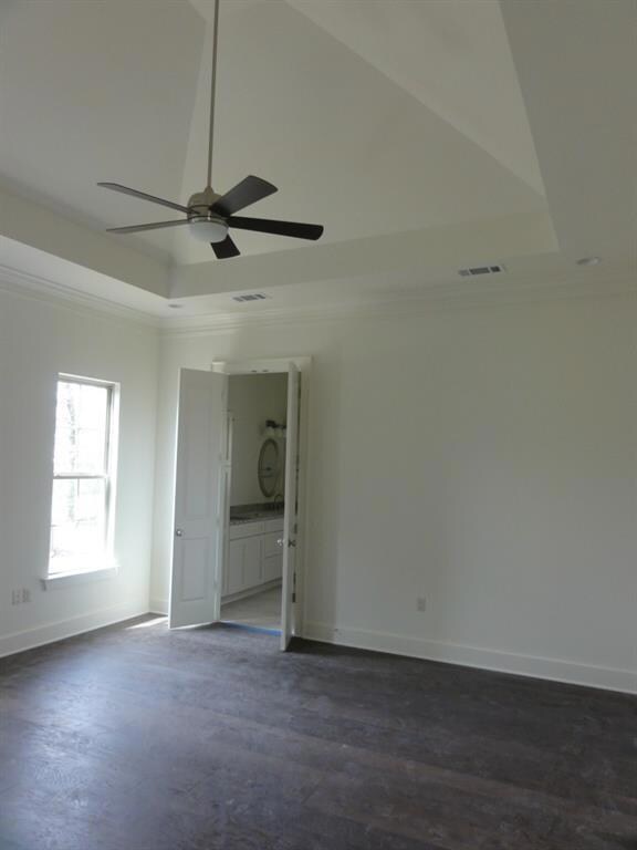 Master bedroom with wood floors & high, sloped cei