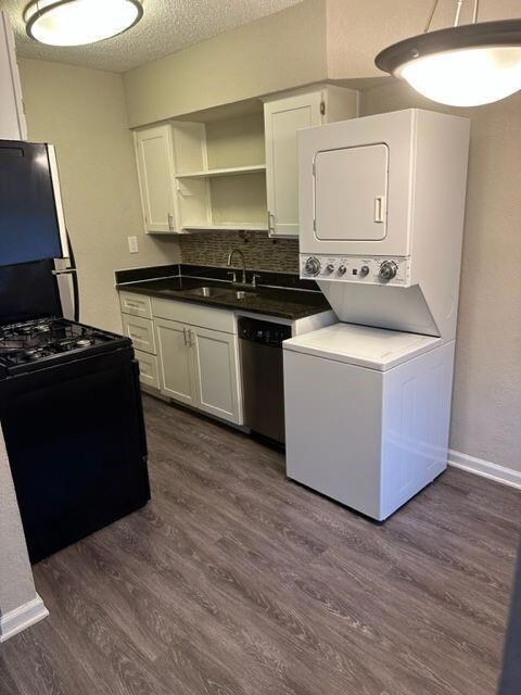 Kitchen featuring dark wood finished floors, stac
