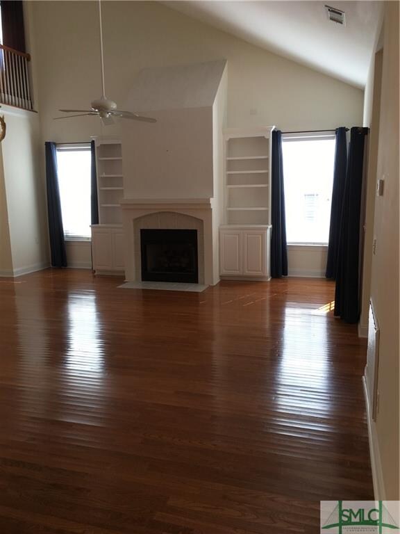 Den with gas fireplace and gas logs with built in 