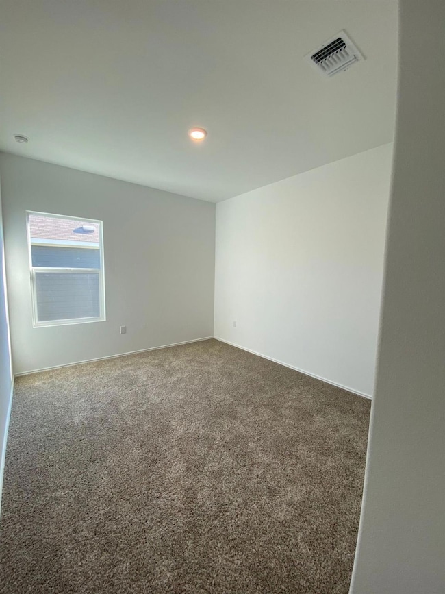 Unfurnished room with carpet and recessed lighting