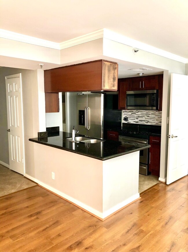 Breakfast bar with plenty of cabinet storage.