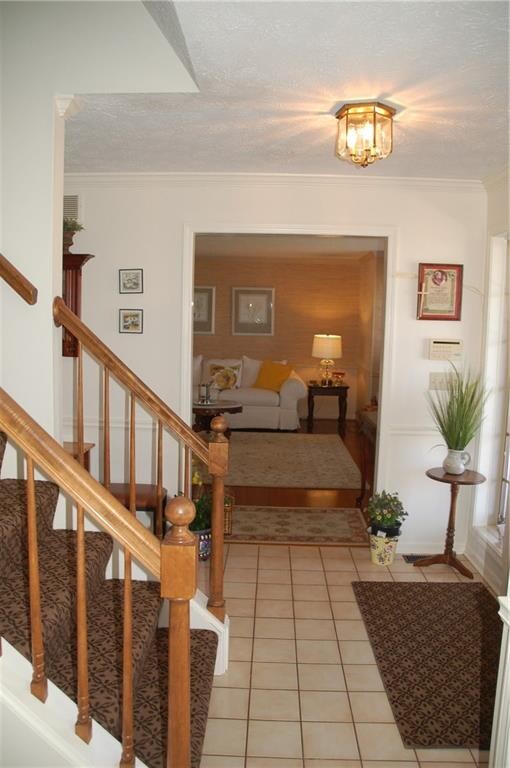 Entry way looking towards living room from den/off