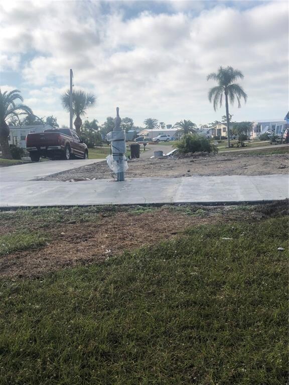 looking toward Penguin Lane.  Lake is at my back.  Wrapped post is the electric.