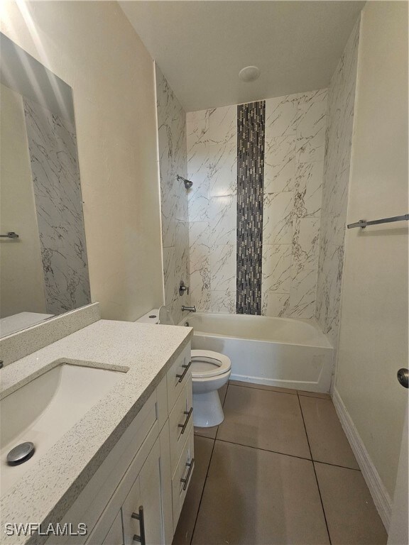 Bathroom with tub / shower combination, toilet, ti
