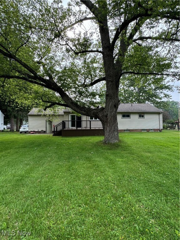 Back yard, back of house with large deck
