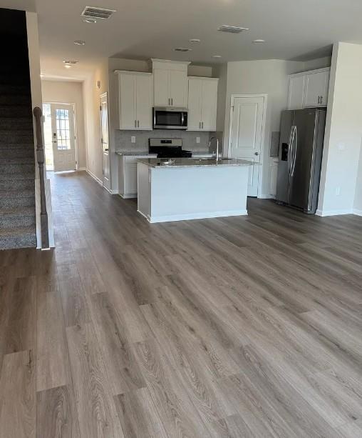 Kitchen featuring stainless steel appliances, visi