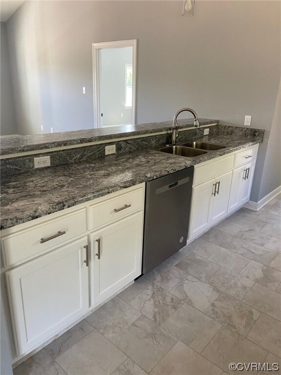 Kitchen featuring light  flooring, stainless steel