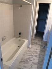Bathroom featuring tub / shower combination