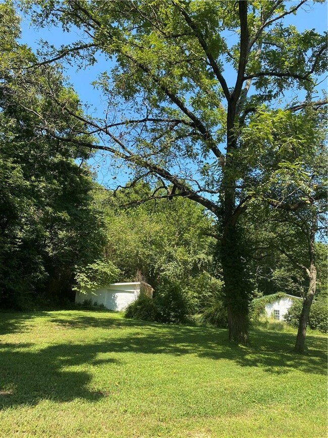 Large yard and gravel drive