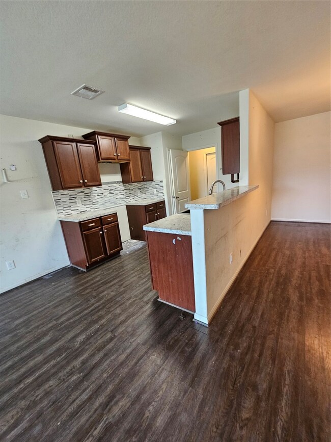 Serving bar to the dining area.  Stove will be installed.