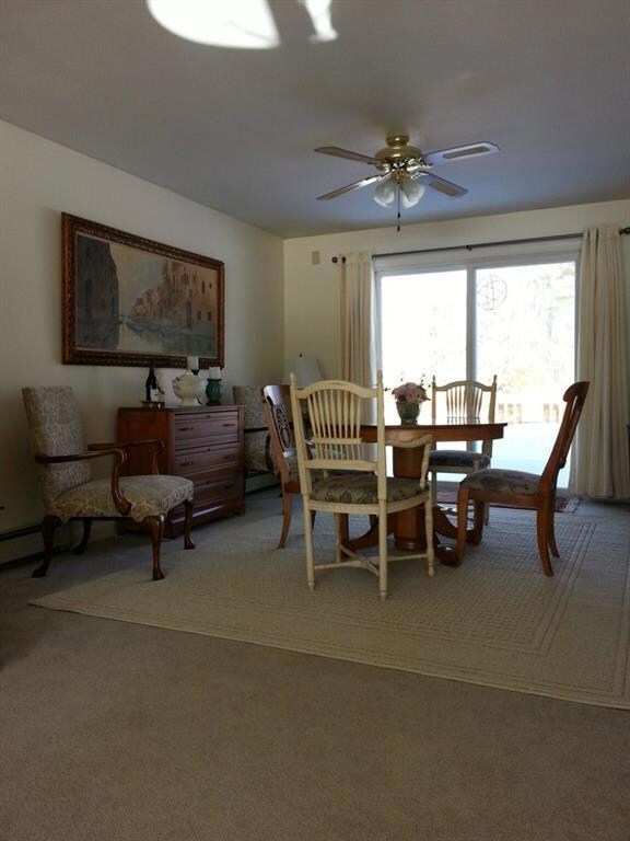 Open concept, this dining area has a...