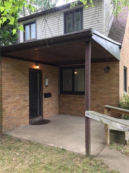 Quite side porch with beautiful view of backyard
