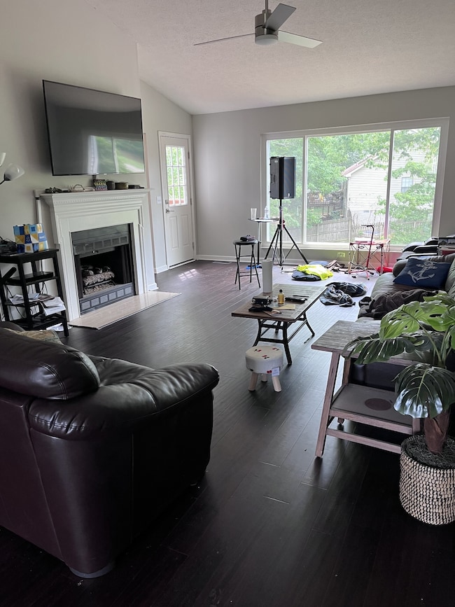 Main floor living area with big window overlooking the backyard.