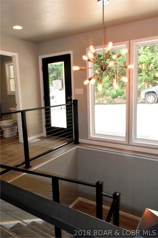 Light and bright entry with new contemporary stair