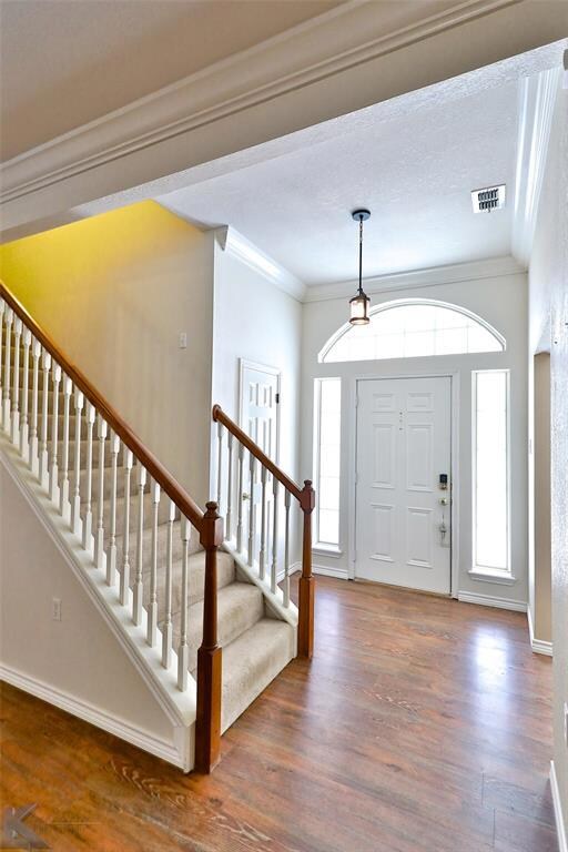 Welcoming entry, arched window and side lights.  S