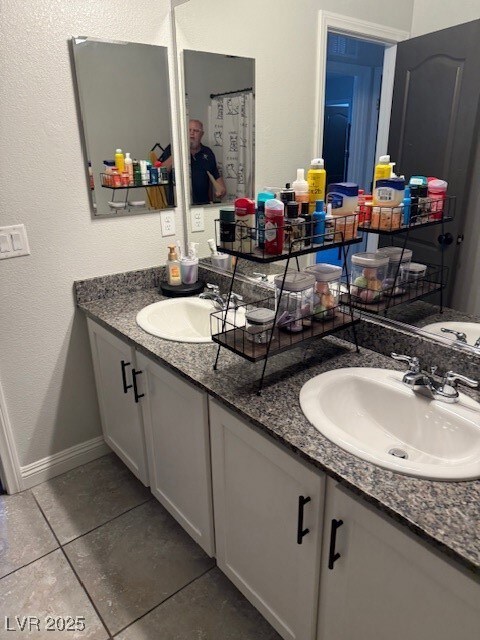 Full bathroom with tile patterned flooring, a sink