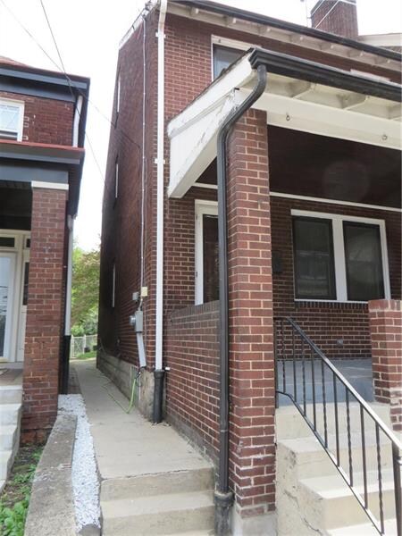 Walkway leading to rear of property