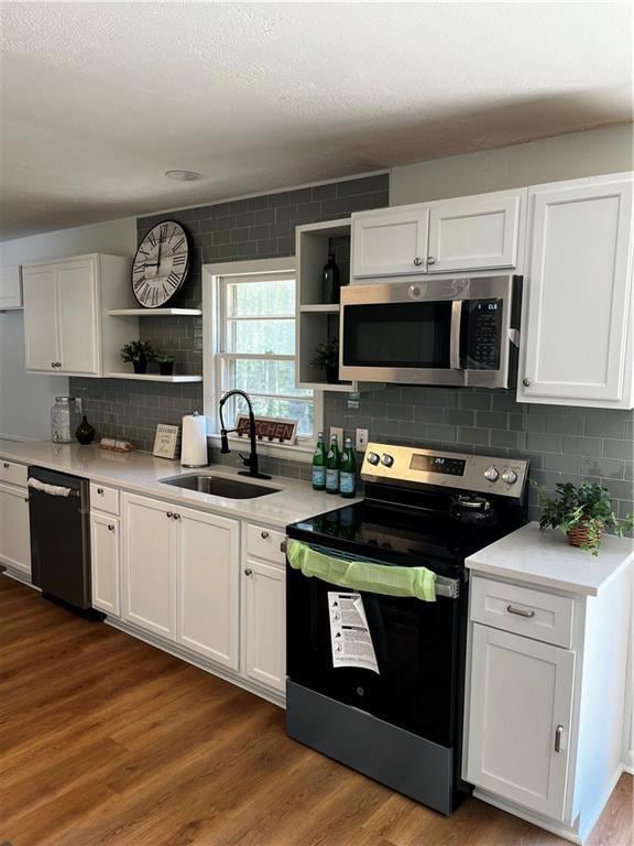 Kitchen featuring range, open shelves, dark wood f