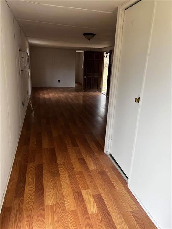 Hall featuring dark wood-style flooring