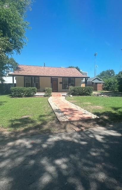Single story home with a front lawn