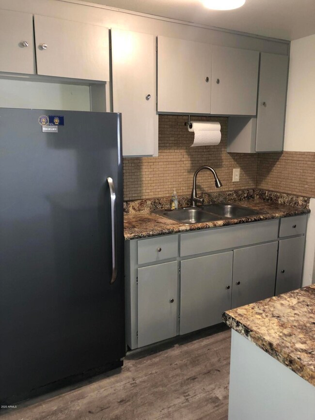 freshly painted cabinets with new hardwa