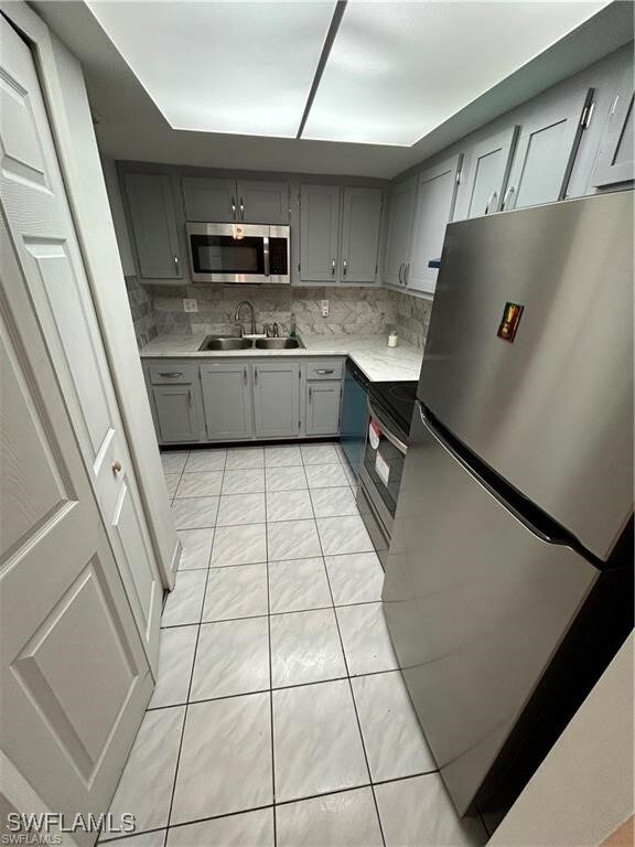 Kitchen featuring appliances with stainless steel