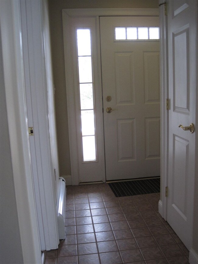 There's a coat closet just inside the foyer.