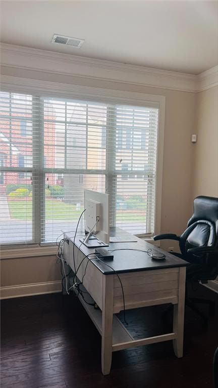 Office area with dark hardwood / wood-style flooring and ornamental molding