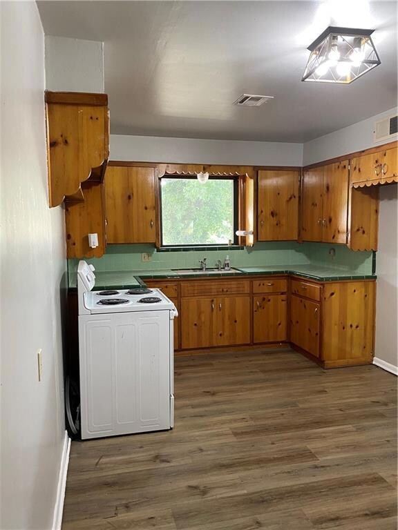 Vintage pine cabinets in this large kitchen with n