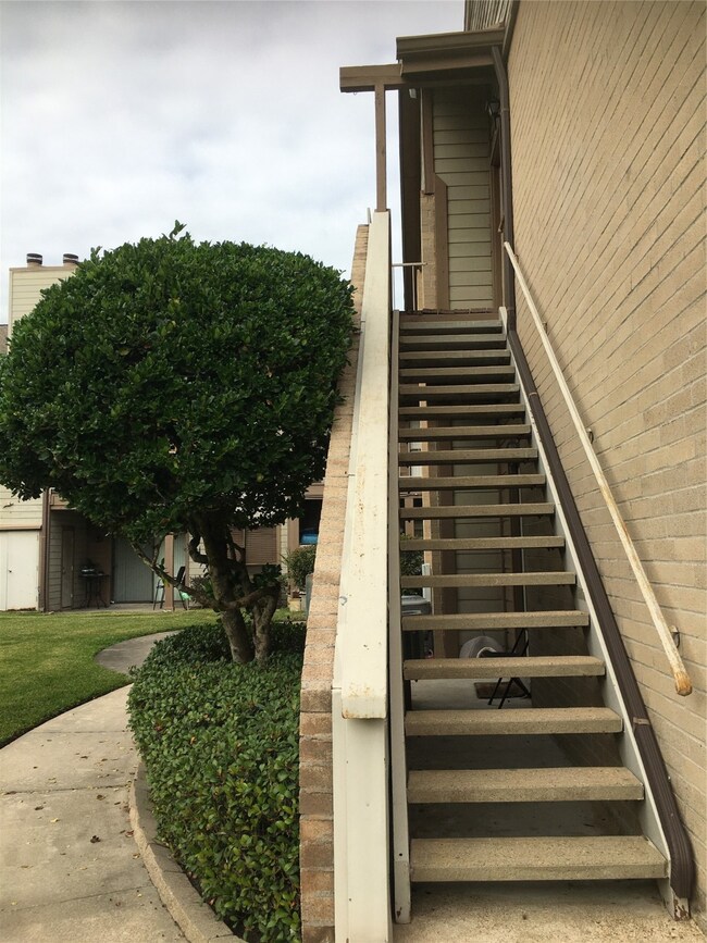 Upstairs private entrance with covered roof.
