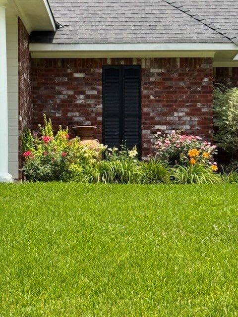 Side of Structure featuring Landscaping
