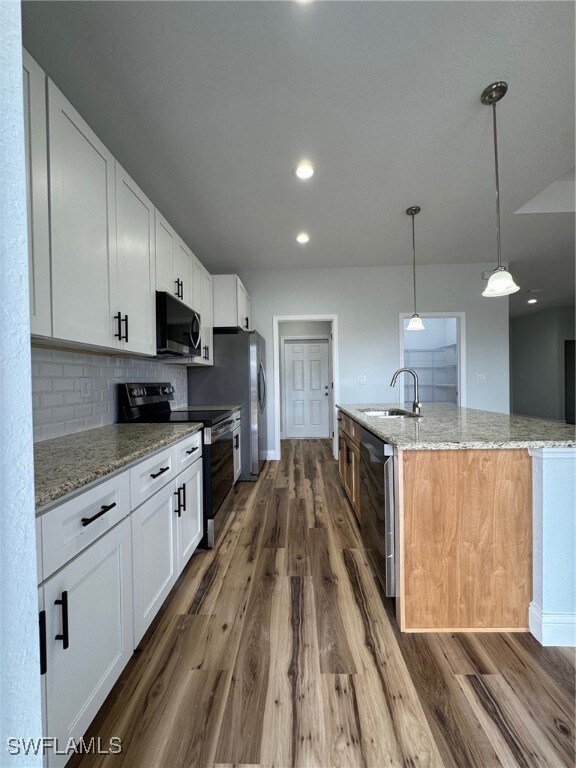 Kitchen featuring white cabinetry