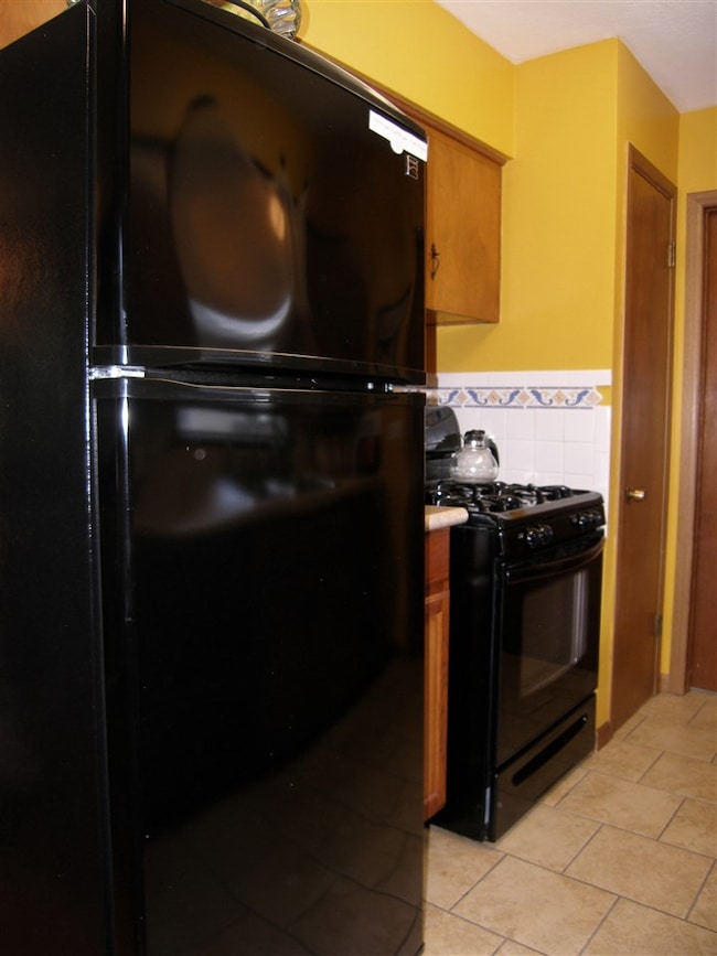 The pantry is located on the far side near the doo