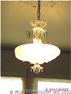 Antique light fixture in dining room adds to house