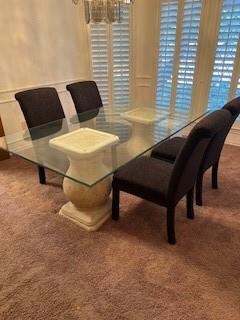 Dining space featuring a notable chandelier and ca