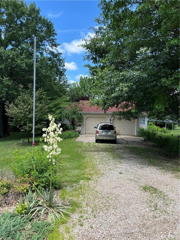 View of yard with a garage