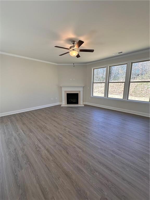 Bathed in natural light and featuring a gas fireplace.