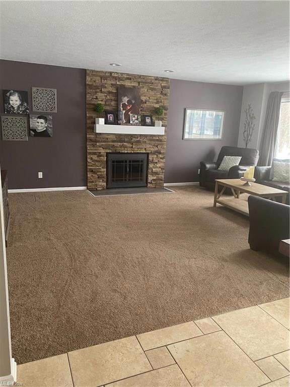 Family room with updated fireplace and new carpet