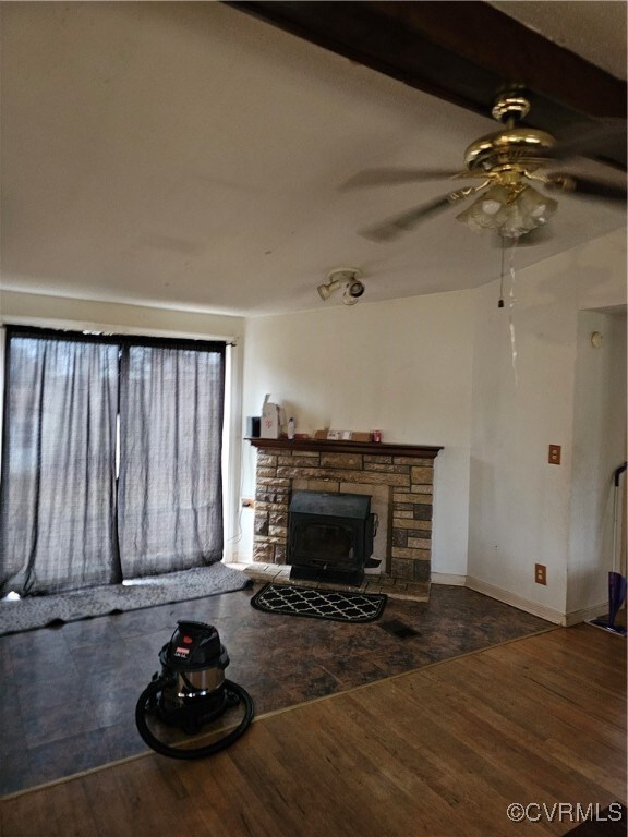 Unfurnished living room featuring hardwood / wood-