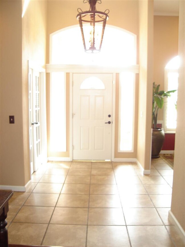 Looking back at entry with formal dining room to r