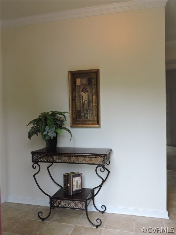 Foyer, crown molding, tile floor