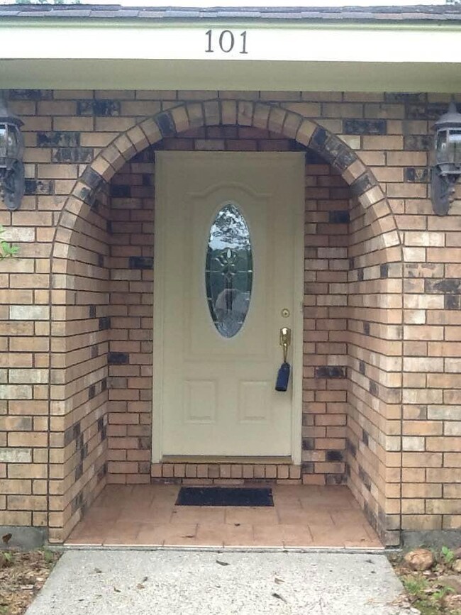FRONT DOOR WITH BRICK ARCH