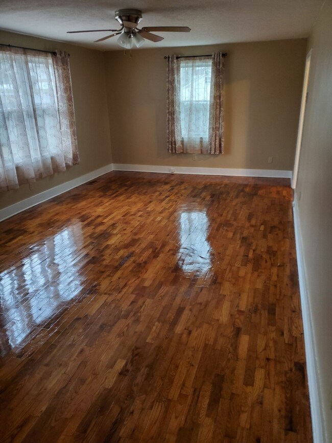 Beautiful and Durable Hardwood Floors have just been Refinished!  Large Living Room with Extra Space for Dining Area. 